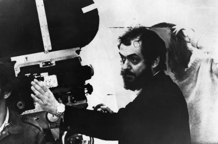 Stanley Kubrick, one of the pioneers of psychological horror, at work on set.