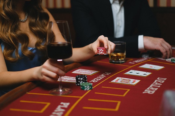 Woman in Black Playing Poker