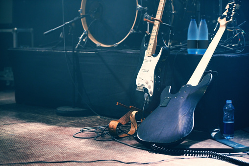 Musical instruments on an empty stage before a show. (Photo via Getty Images)
