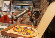 PIzza being prepared and packed.