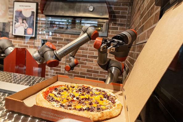 PIzza being prepared and packed.