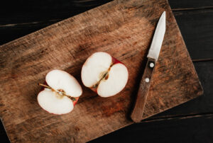 Sliced apple with a knife