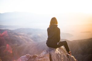 Woman sat on a rock